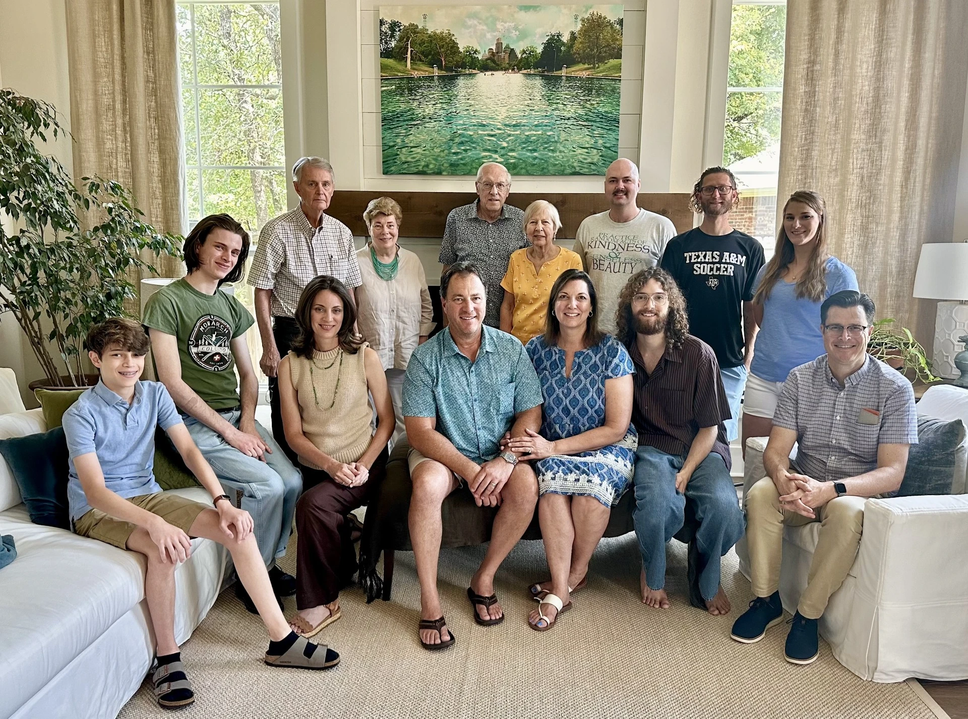 A family posing for a photo in a living room.